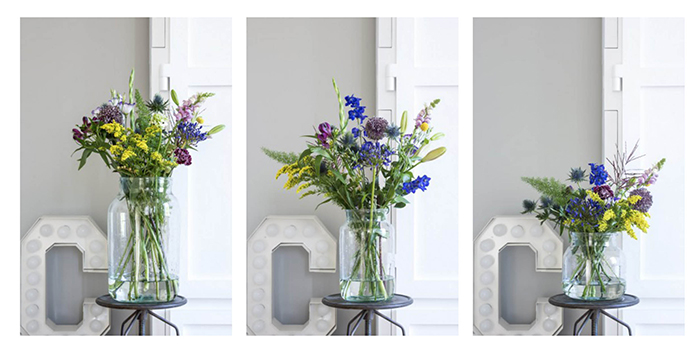 Klare vaser og blomster lige til døren